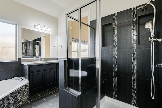 bathroom with vanity, a shower stall, plenty of natural light, and a bath