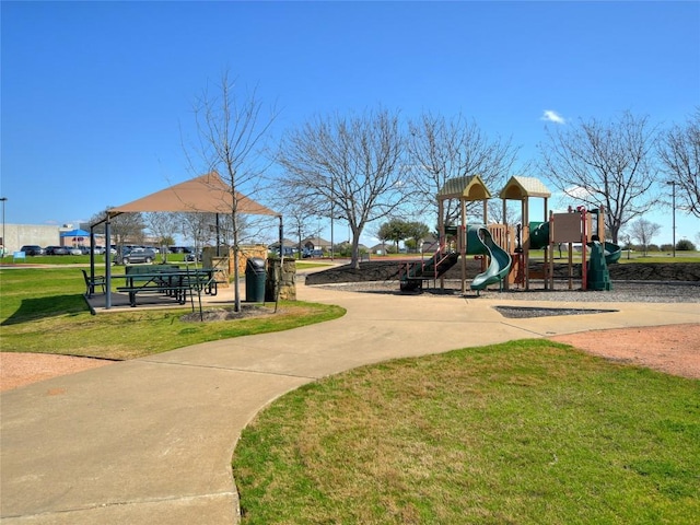 community playground featuring a lawn