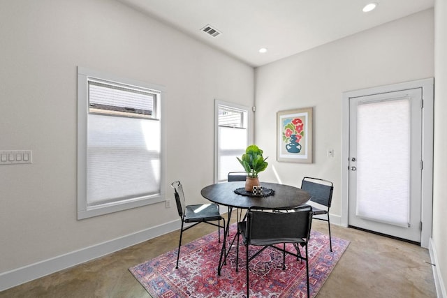 dining space featuring recessed lighting and baseboards