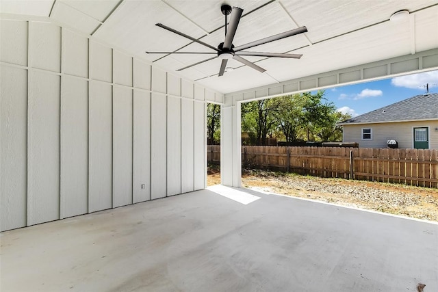 view of patio featuring a ceiling fan and fence