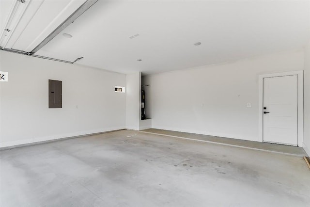 garage with water heater and electric panel