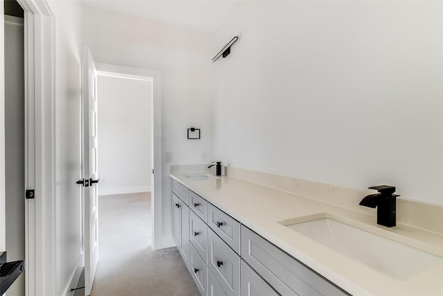 full bath with a sink and double vanity