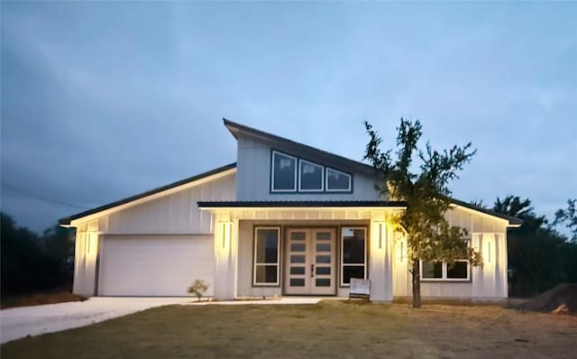 contemporary home with an attached garage and driveway