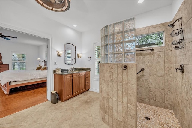 bathroom featuring tile patterned floors, a walk in shower, ensuite bathroom, and ceiling fan