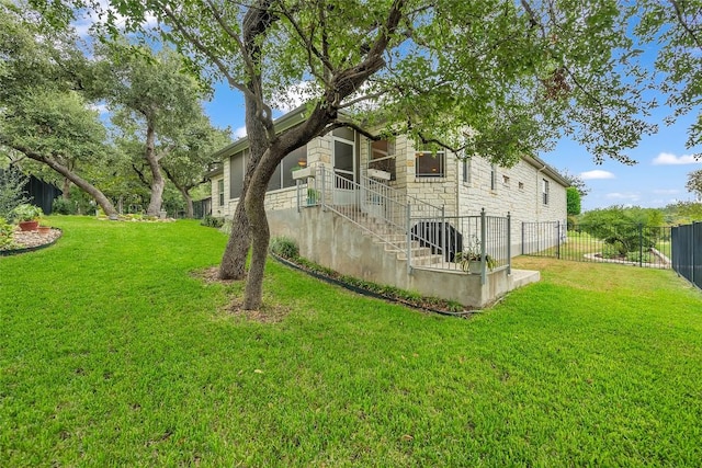 view of yard featuring stairs and fence