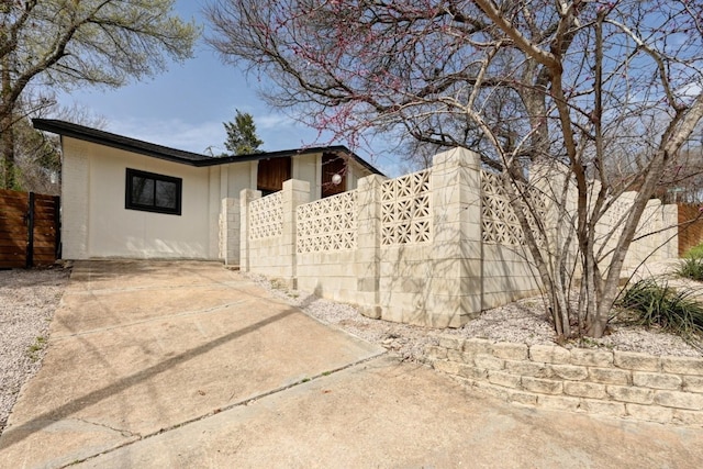 view of property exterior with fence