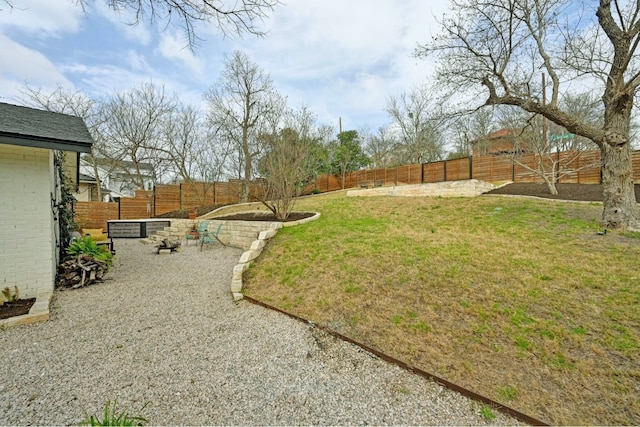 view of yard with a fenced backyard