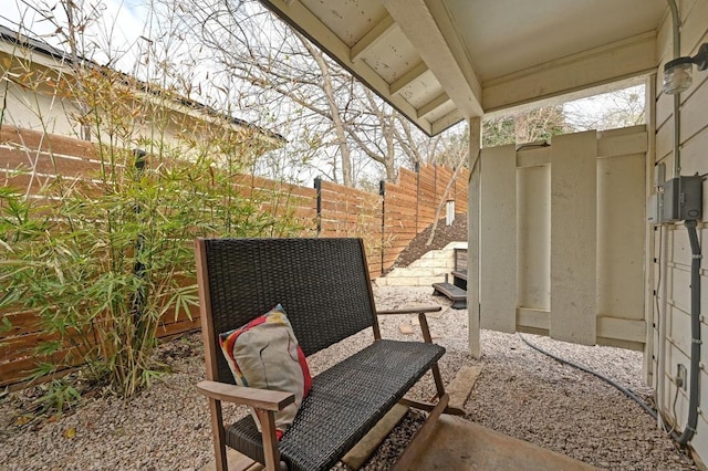 view of patio featuring fence