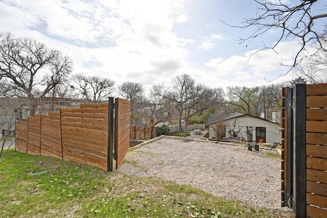 view of gate featuring fence