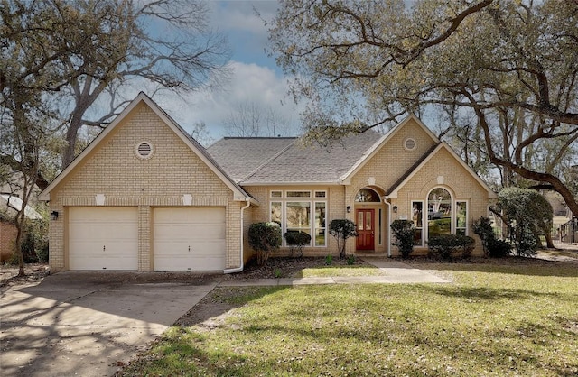 view of front of property with a front lawn, a garage, brick siding, and driveway