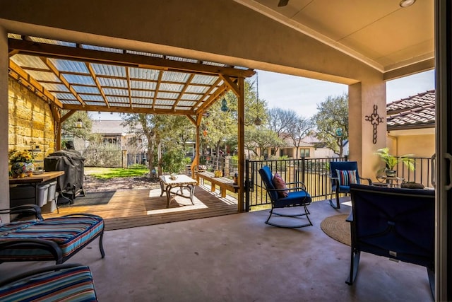 view of patio featuring area for grilling and a pergola