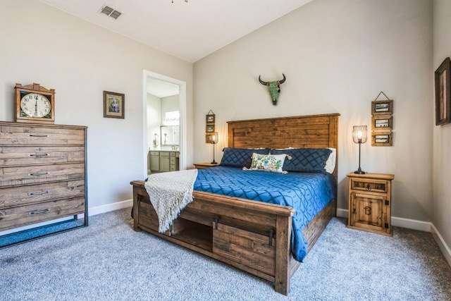 carpeted bedroom featuring baseboards, visible vents, and connected bathroom