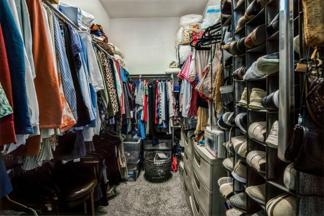 walk in closet with carpet floors