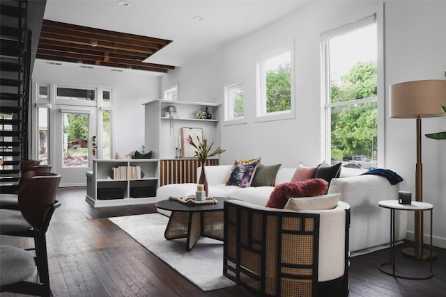 living area with baseboards and hardwood / wood-style floors