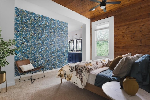 carpeted bedroom with wooden walls and wooden ceiling