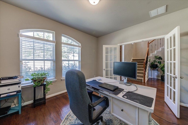 home office with visible vents, french doors, baseboards, and wood finished floors