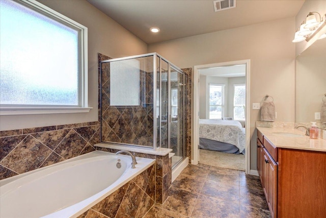 ensuite bathroom featuring vanity, visible vents, a stall shower, ensuite bathroom, and a garden tub