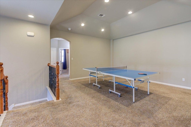 game room with visible vents, arched walkways, carpet floors, and baseboards