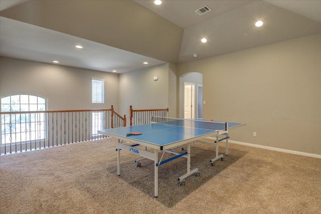 game room featuring arched walkways, carpet flooring, high vaulted ceiling, and visible vents