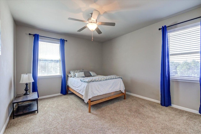 bedroom featuring baseboards, carpet floors, and ceiling fan