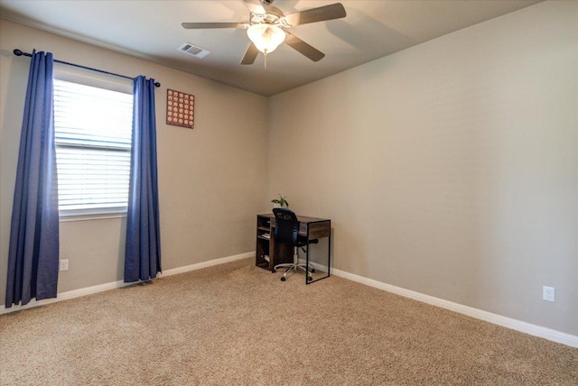 unfurnished room with visible vents, baseboards, carpet, and ceiling fan