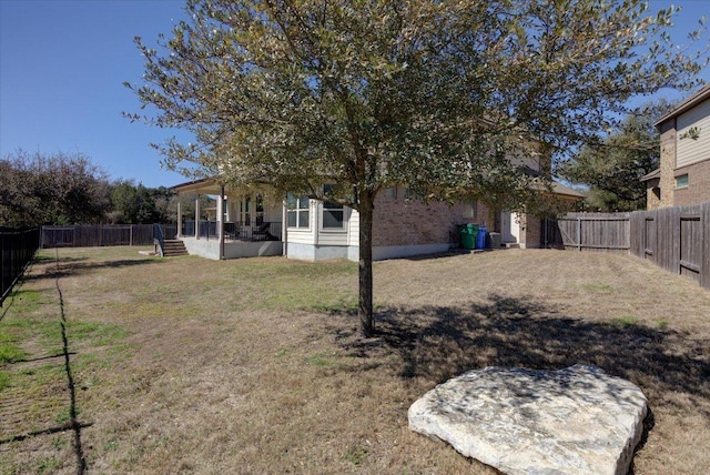 view of yard featuring a fenced backyard