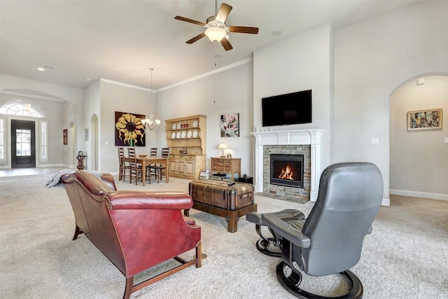 114 Angela Rose Ct, Austin, TX 78737 - living room featuring arched walkways, light carpet, and baseboards