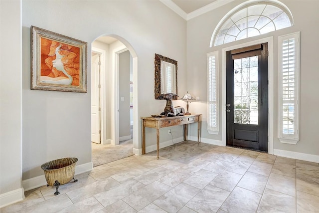 114 Angela Rose Ct, Austin, TX 78737 - entryway with arched walkways, ornamental molding, healthy amount of natural light, and baseboards