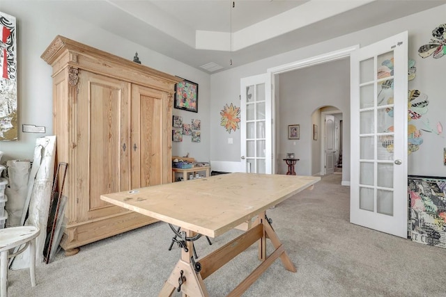 114 Angela Rose Ct, Austin, TX 78737 - dining space featuring french doors, light carpet, and arched walkways
