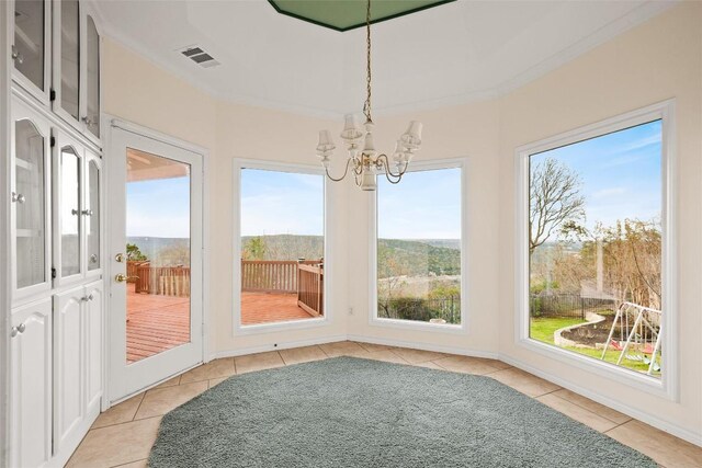 5315 Valburn Cir, Austin, TX 78731 - unfurnished sunroom featuring a chandelier and tile patterned flooring