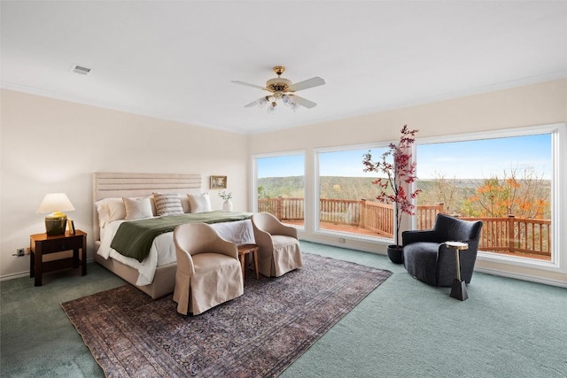 carpeted bedroom featuring ornamental molding, baseboards, a ceiling fan, and access to outside