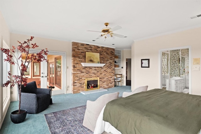 bedroom featuring visible vents, crown molding, carpet flooring, french doors, and a fireplace