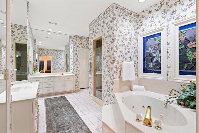 full bath with visible vents, two vanities, a stall shower, wallpapered walls, and a whirlpool tub