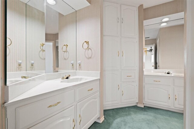 5315 Valburn Cir, Austin, TX 78731 - bathroom featuring wallpapered walls and vanity