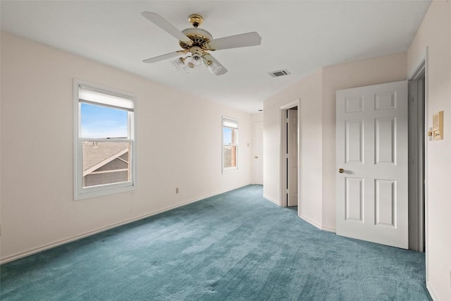 unfurnished bedroom featuring visible vents, carpet flooring, baseboards, and a ceiling fan