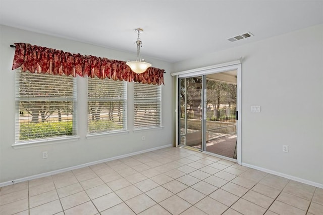 unfurnished dining area featuring visible vents and baseboards