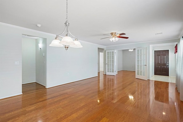 316 Barrington Farm Ct, Georgetown, TX 78633 - unfurnished room with crown molding, baseboards, french doors, wood finished floors, and a ceiling fan