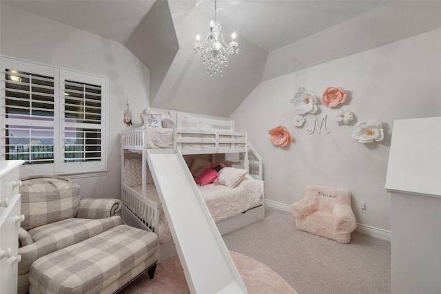 bedroom with a notable chandelier, baseboards, lofted ceiling, and carpet