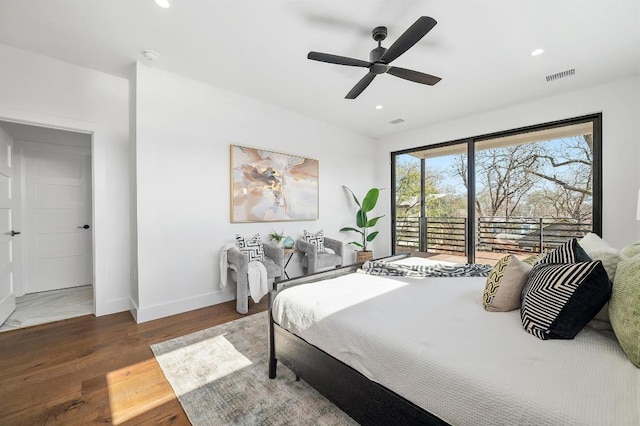 bedroom with wood finished floors, visible vents, baseboards, recessed lighting, and access to exterior