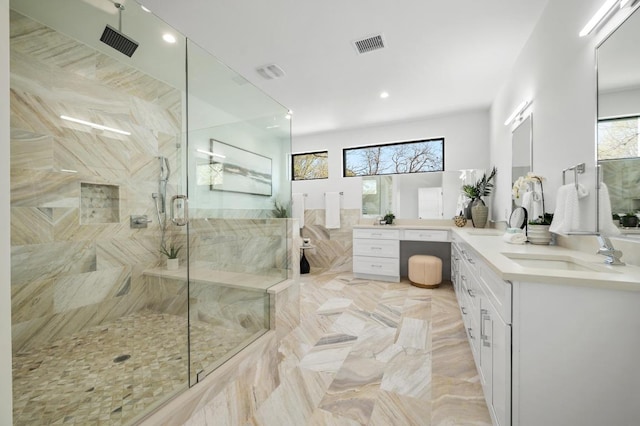 bathroom with vanity, a shower stall, recessed lighting, and visible vents