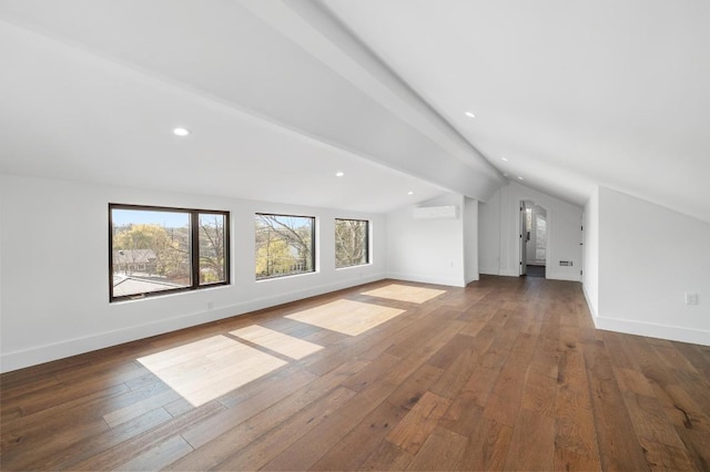 bonus room with dark wood finished floors, lofted ceiling with beams, and baseboards