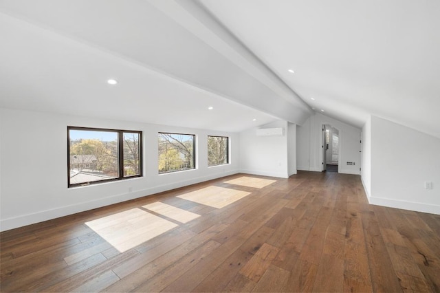 1608 Dexter St, Austin, TX 78704 - additional living space with an AC wall unit, dark wood-style flooring, and recessed lighting
