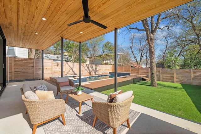 view of patio with an outdoor living space, a fenced in pool, a fenced backyard, and a ceiling fan