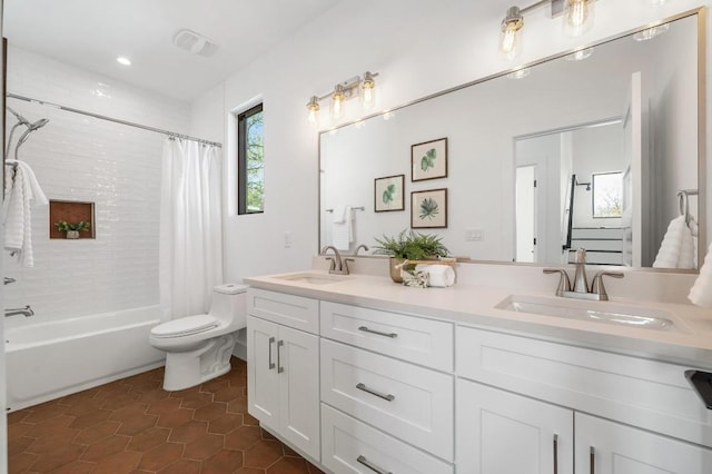 1608 Dexter St, Austin, TX 78704 - full bath featuring double vanity, shower / tub combo with curtain, toilet, tile patterned floors, and recessed lighting