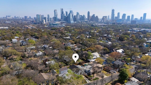 birds eye view of property with a view of city