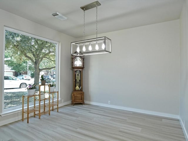 dining space with plenty of natural light and baseboards