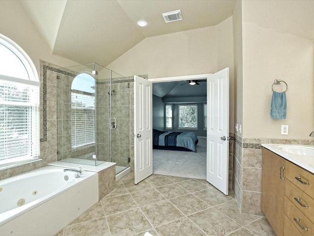 ensuite bathroom featuring visible vents, a shower stall, lofted ceiling, a whirlpool tub, and a ceiling fan