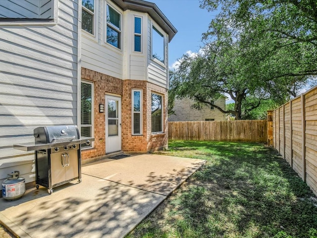 view of patio / terrace with a fenced backyard and grilling area