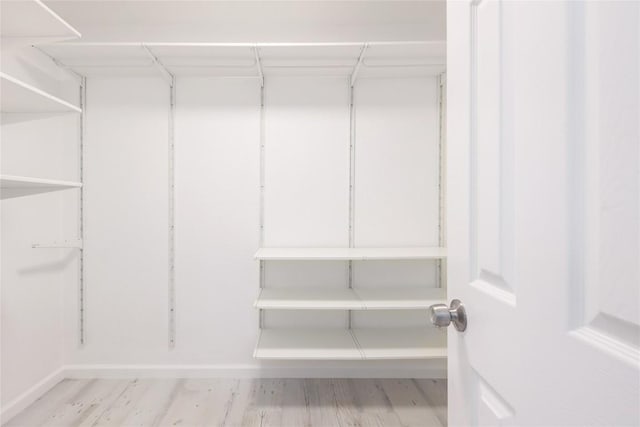 spacious closet with wood finished floors