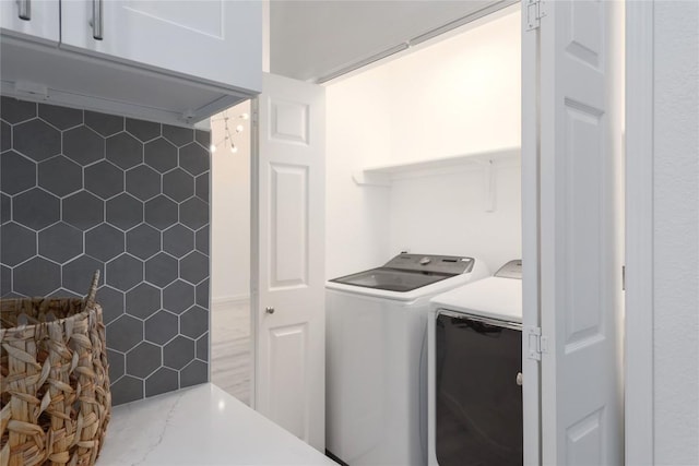 laundry room featuring independent washer and dryer and laundry area